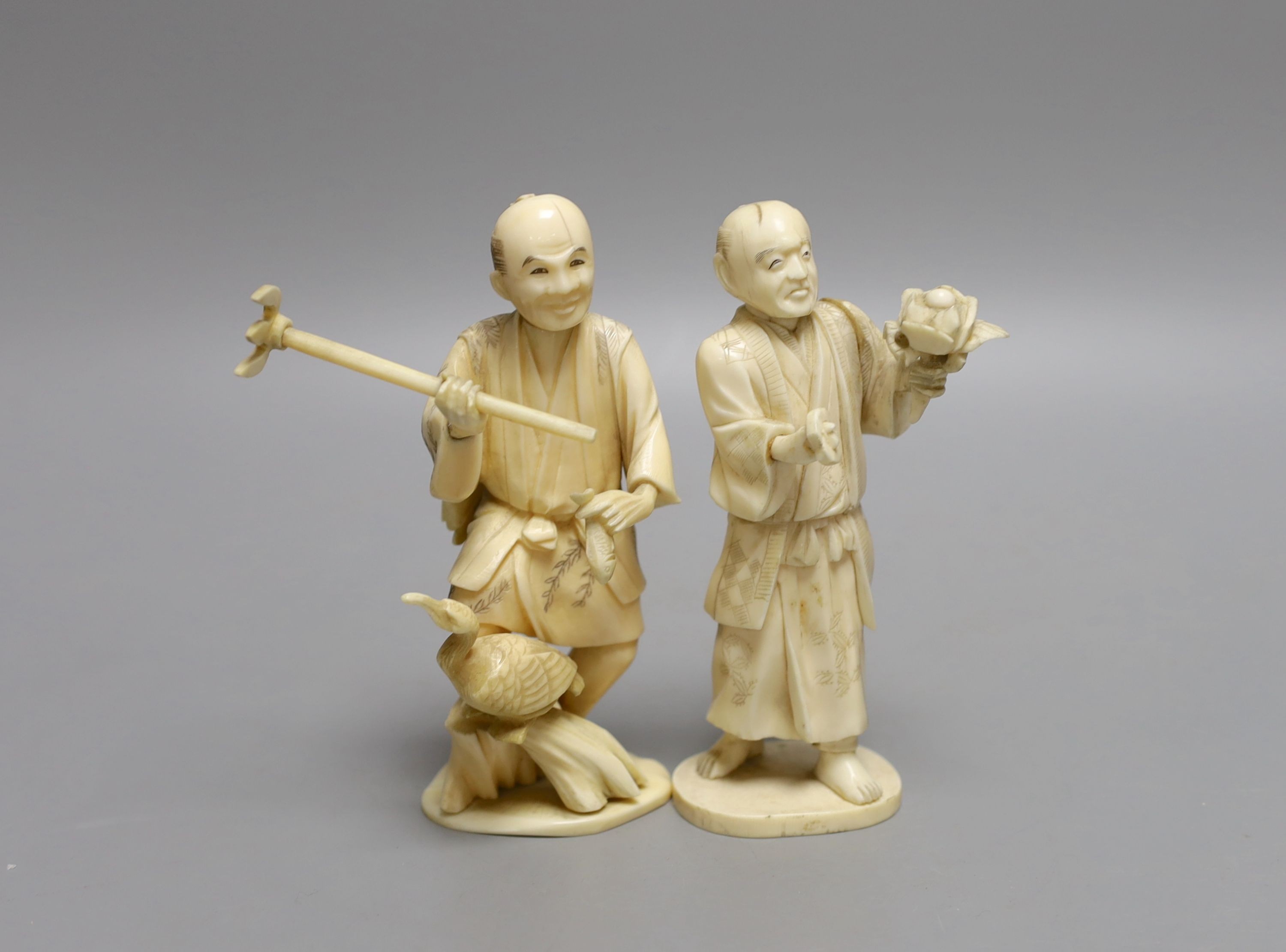 Two Japanese sectional ivory figures of farmers, early 20th century - tallest 13.5cm